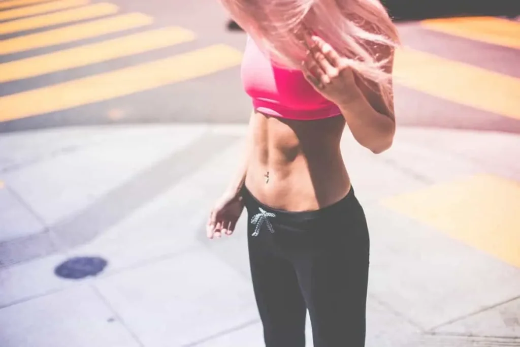 Woman with toned stomach after LA-EMS Body Sculpting Treatment Brixton 